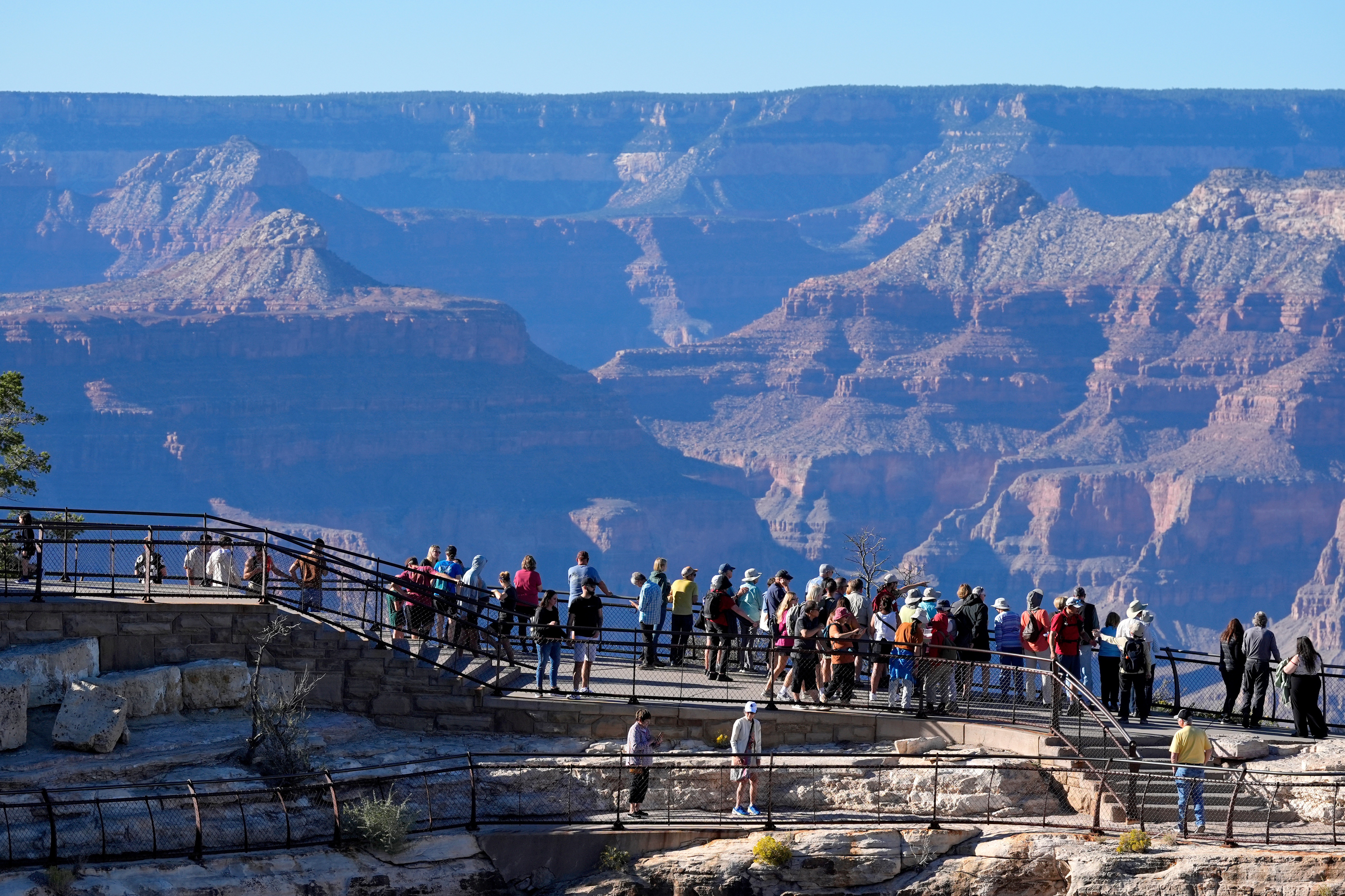 Tourists flock to Mather Point at Grand Canyon National Park, Oct. 1, 2025, in Grand Canyon, Ariz.